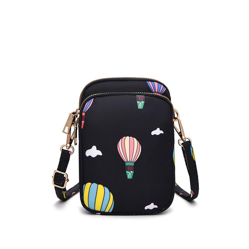 V562-D1082774060DBT-202505191631-00 Women Mini Crossbody Phone Bag With Headphone Hole - Black Balloon - Image 1