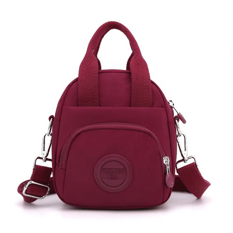 V888-ELOSUNG15533-214198-00 Red Mini Waterproof Nylon Backpack - Lightweight Casual Crossbody Bag - Image 1