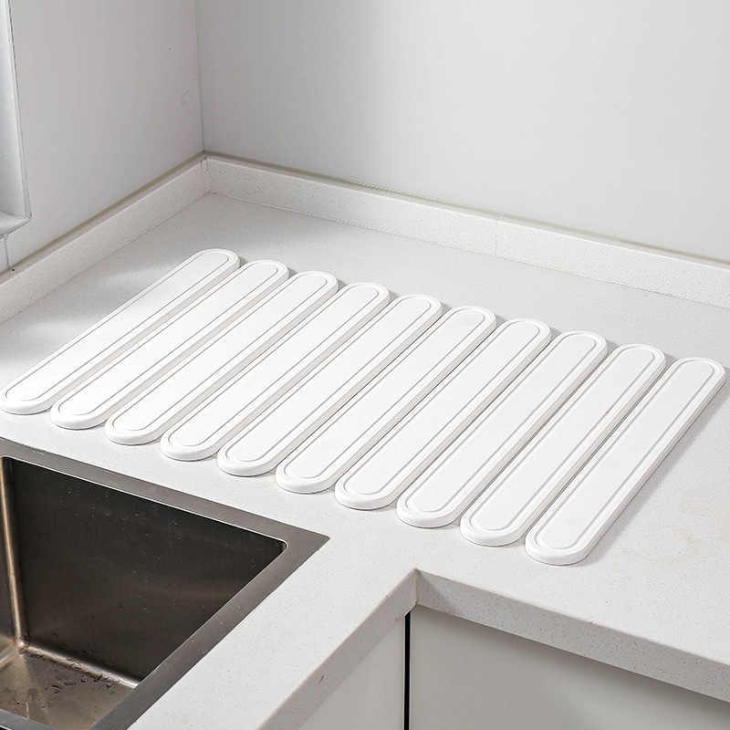 V888-ELOSUNG17211-214919-00 White Oval Shaped Engraved Inner Frame Foldable Diatomaceous Earth Drying Mat - Super Absorbent, Fast-Drying, Non-Slip Kitchen Countertop Mat - Image 1